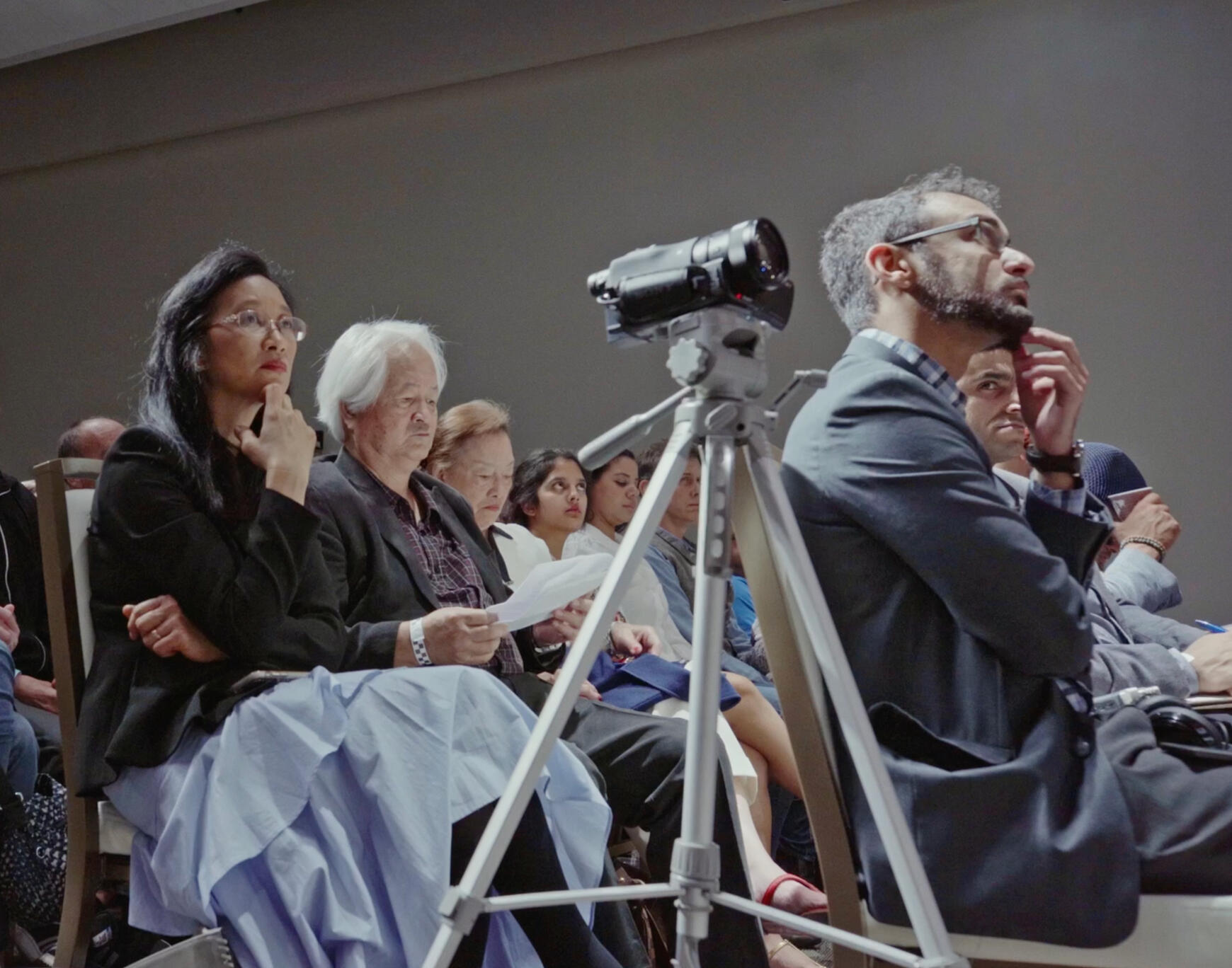 Audience members watching a screening of I'd Rather Be Dead Than Silent, new documentary film